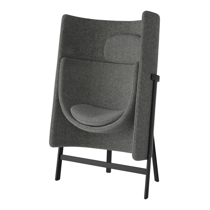 Gray upholstered chair with a minimalist design and soft, smooth surface, featuring a simple, sleek black frame.