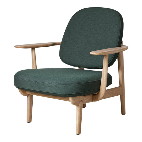 Green fabric armchair with a smooth, minimalist design and natural wood legs, featuring a cozy, modern aesthetic.