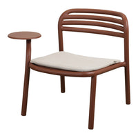 Brown chair with a simple slatted back, beige cushion, and a matching side table. Modern and minimalist design.