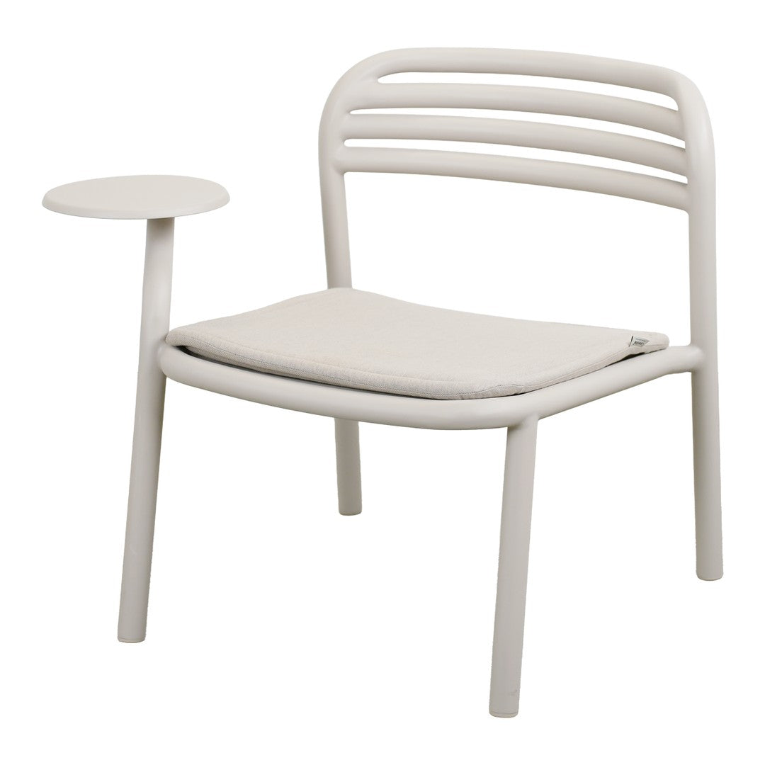 Light beige chair with a curved back, simple lines, and a matching side table, featuring soft cushioned seating.