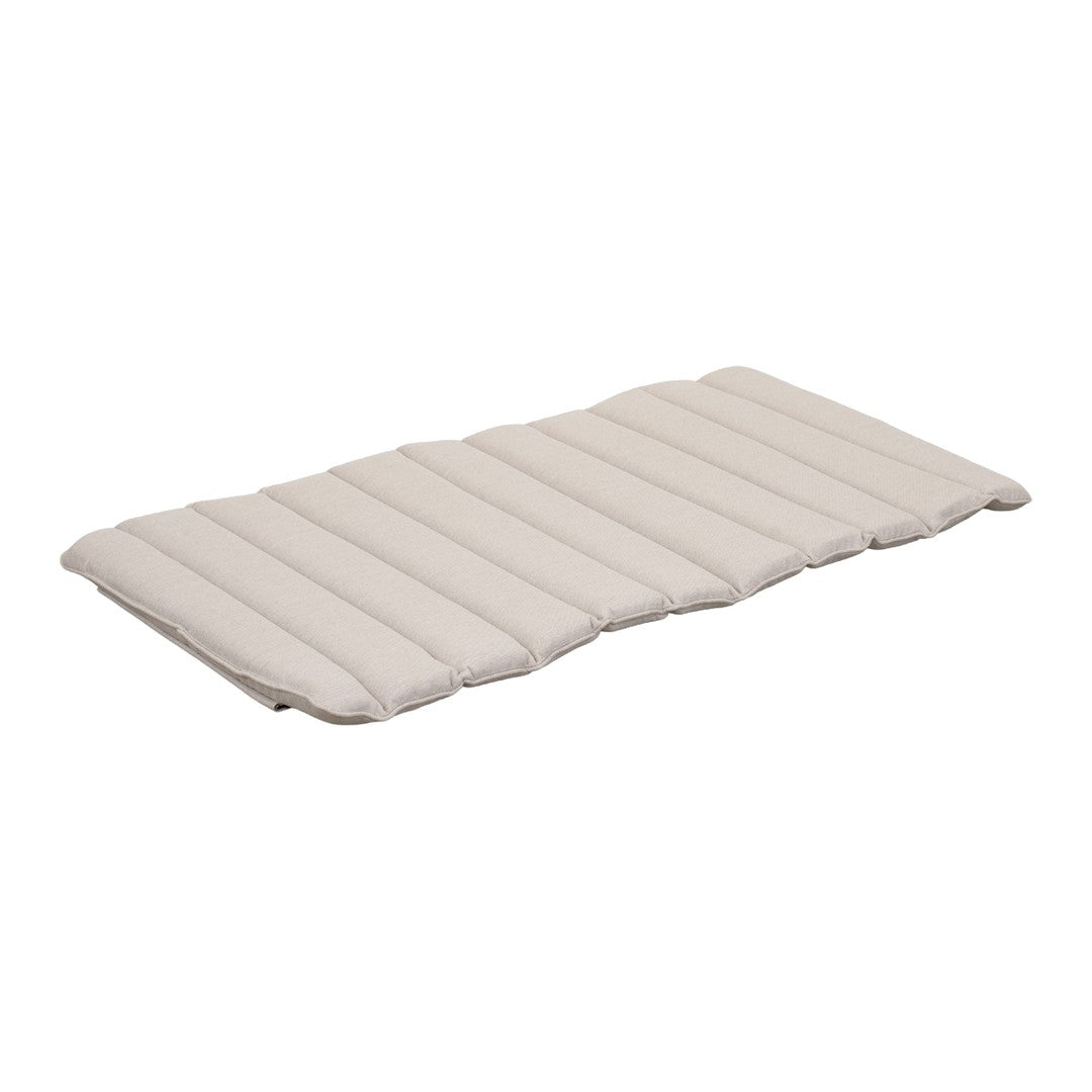 Light beige padded mattress with a quilted, striped pattern, perfect for comfort and style.