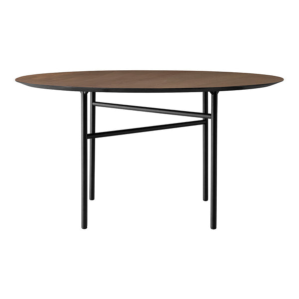Round wooden table with a rich brown surface and sleek black metal legs, showcasing a minimalist design.