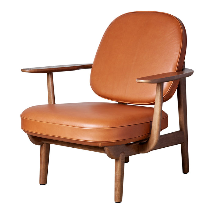 Mid-century modern chair in rich tan leather with smooth curves and warm wooden accents. Ideal for stylish interiors.