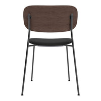 Modern chair with a dark wood backrest, black cushion seat, and sleek black metal legs, perfect for versatile decor.
