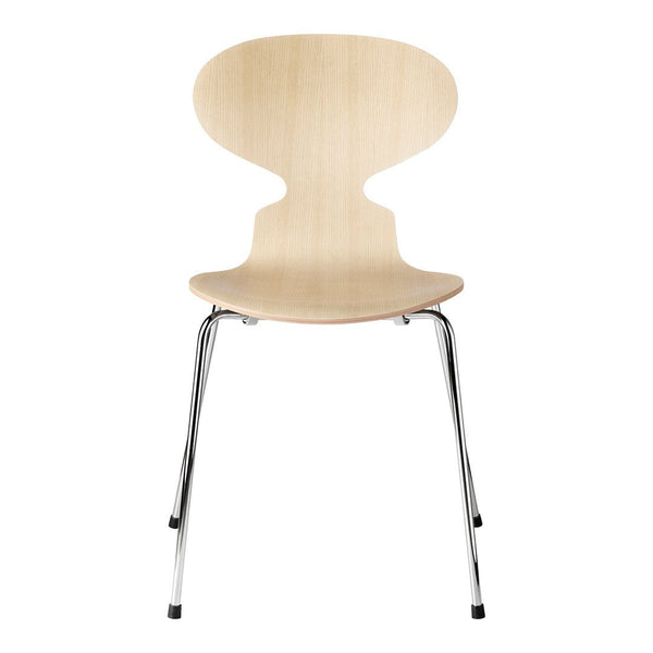 Natural wood grain chair with a smooth finish and chrome legs, featuring a minimalist and modern design.