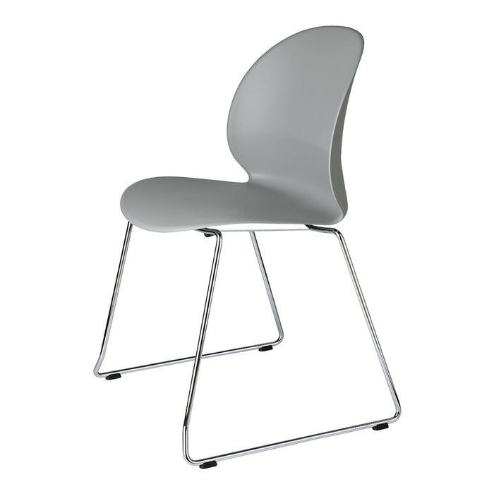 Sleek gray molded chair with a modern design and chrome legs, perfect for contemporary spaces.