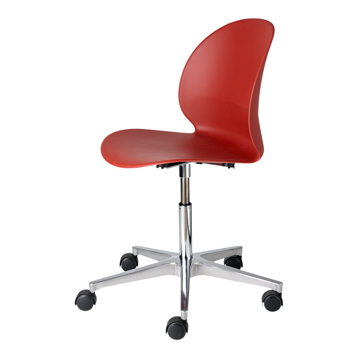 Red molded plastic chair with a sleek, curved design and chrome base, featuring a modern, minimalist aesthetic.