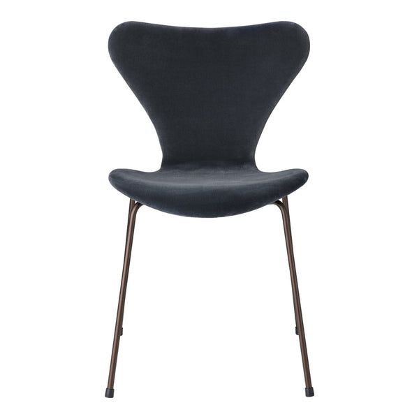 Stylish dark gray chair with a smooth texture and elegant curves, featuring slender bronze legs. Perfect for modern decor.