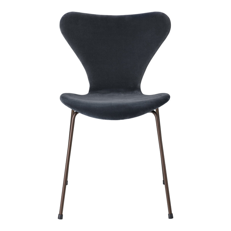 Stylish dark gray chair with a smooth texture and elegant curves, featuring slender bronze legs. Perfect for modern decor.
