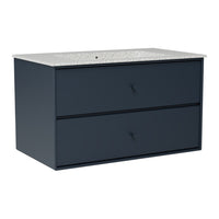 Navy blue vanity with a textured white and gray speckled countertop and sleek dark handles.