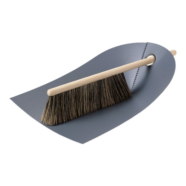 Gray dustpan with a natural wood handle and black bristles. Sleek, minimalist design ideal for modern interiors.