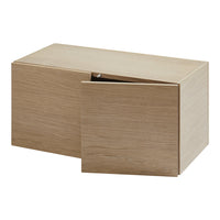 Light oak storage box with a smooth, natural wood finish and simple design, featuring two sliding doors.
