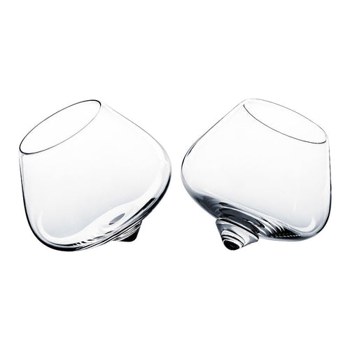 Set of two clear, curved glass tumblers with a unique, modern design. Perfect for elegant dining and entertaining.