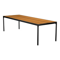 Rectangular dining table with a warm wooden top and sleek black metal legs, showcasing a contemporary design.