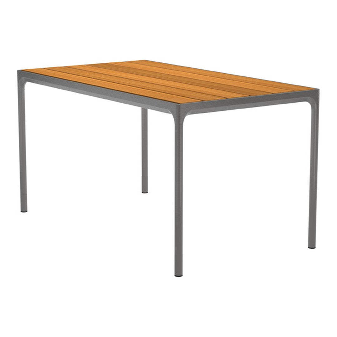 Rectangular table with a warm orange wood top and sleek gray metal legs, featuring simple, modern lines.