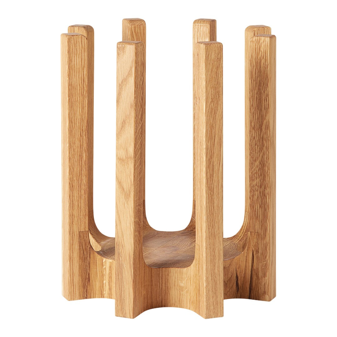 Natural wood plant holder with a minimalist design and smooth finish, featuring a light oak color and simple geometric pattern.