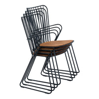 Stacked chairs featuring a sleek black metal frame and warm wooden seats in a geometric pattern.