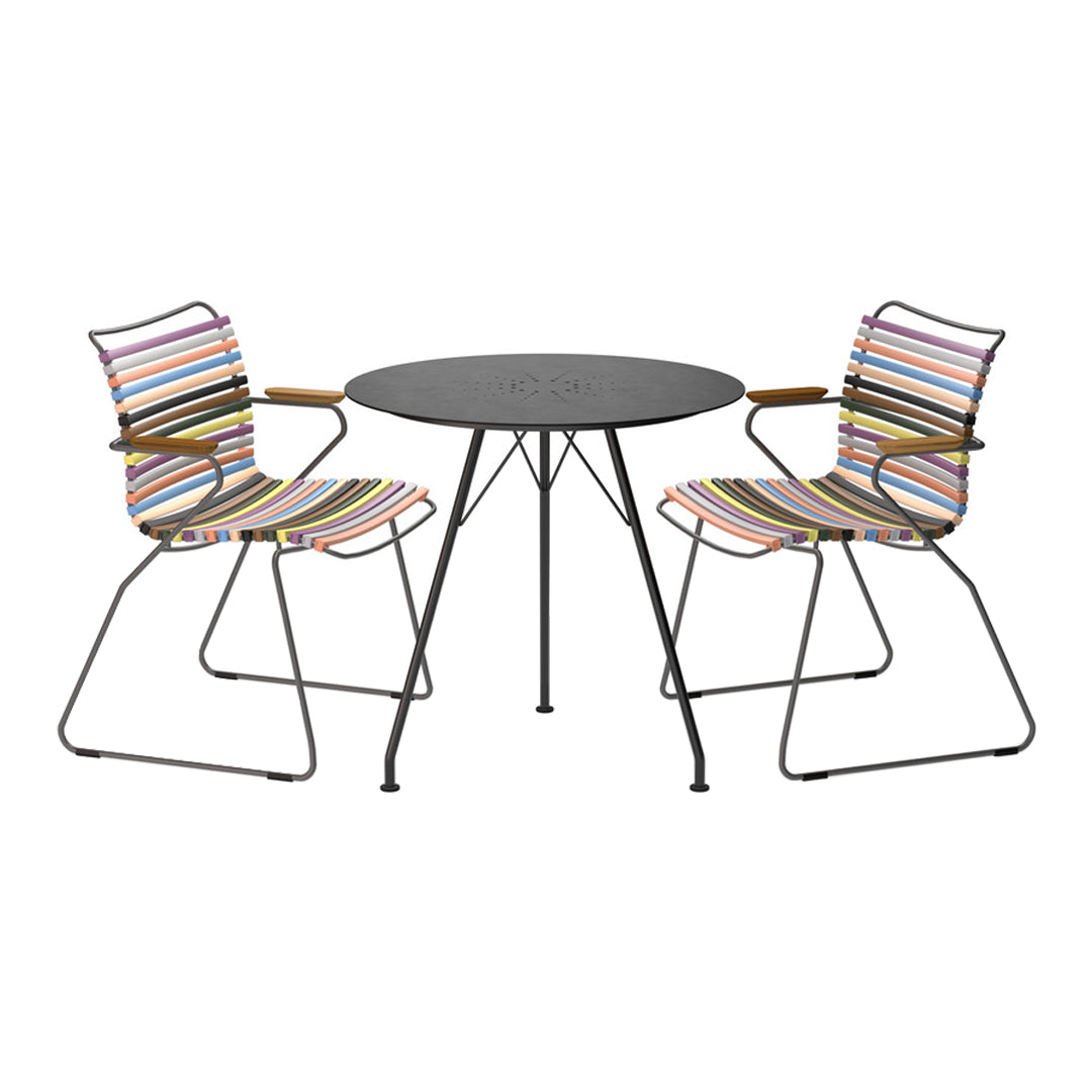 Multicolored striped chairs and a sleek black tabletop create a vibrant outdoor dining set. Perfect for stylish gatherings.
