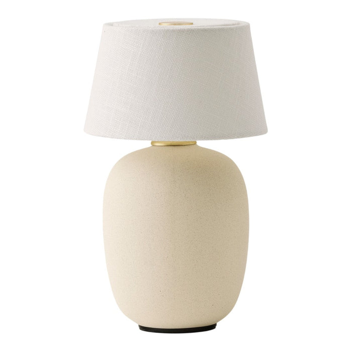 Cream-colored ceramic lamp base with a white fabric shade, offering a minimalist design and elegant texture.