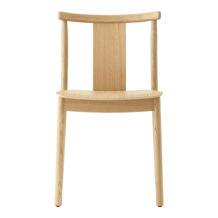 Natural wood chair in a light oak finish with a minimalist design and subtle grain patterns. Ideal for modern decor.