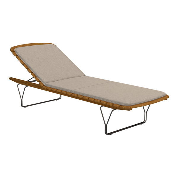 Beige cushioned chaise lounge with a wooden frame and sleek metal legs. Perfect for outdoor relaxation.