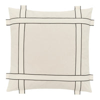 Cream square pillow with a minimalist black grid pattern and tie accents. Perfect for modern decor styling.