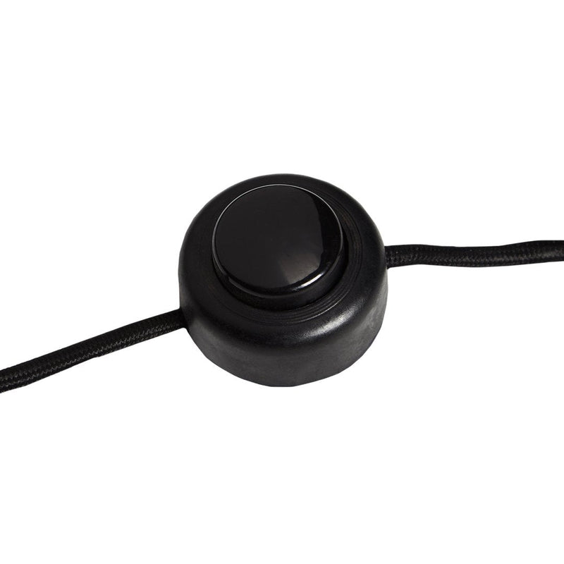 Black round switch with smooth surface and a black cord. Simple and modern design for easy operation.