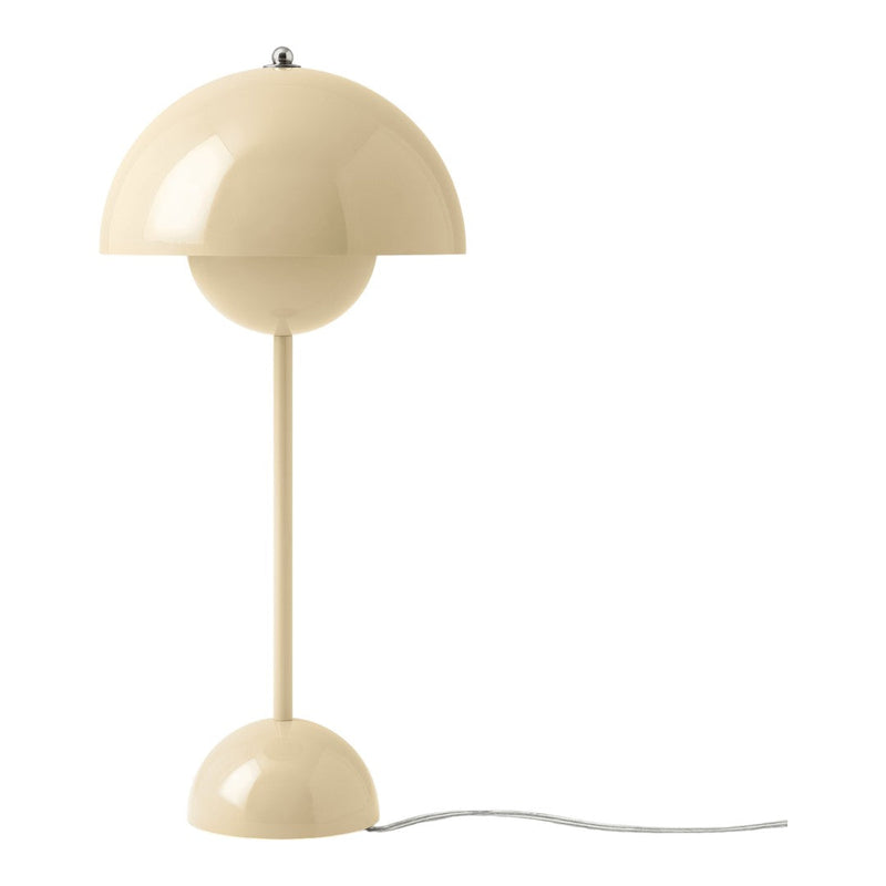 Beige modern table lamp with a curved, glossy shade and round base, perfect for stylish home decor.