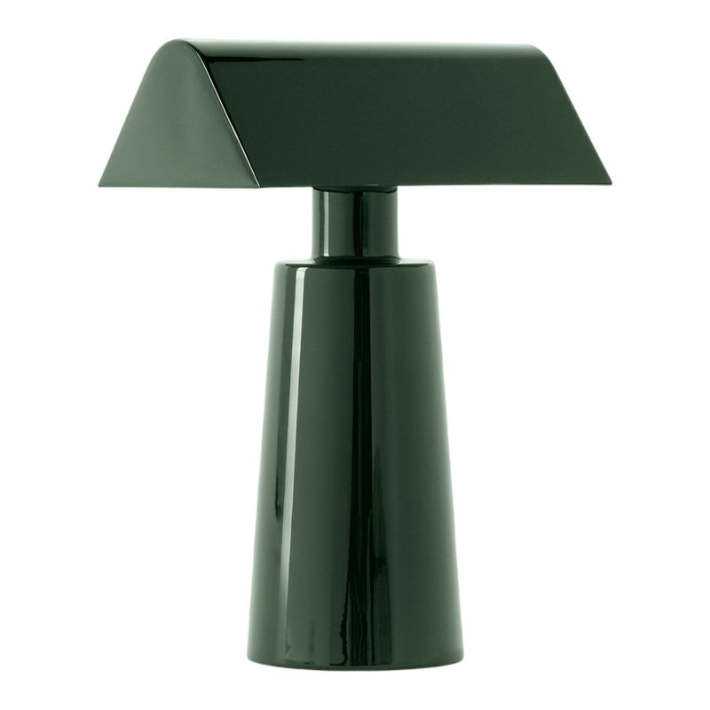 Green modern table lamp with a sleek, geometric design and glossy finish. Ideal for contemporary decor.