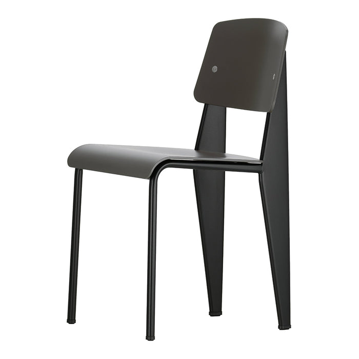 Modern black chair with a sleek design and a smooth finish, featuring angular legs and a minimalist aesthetic.