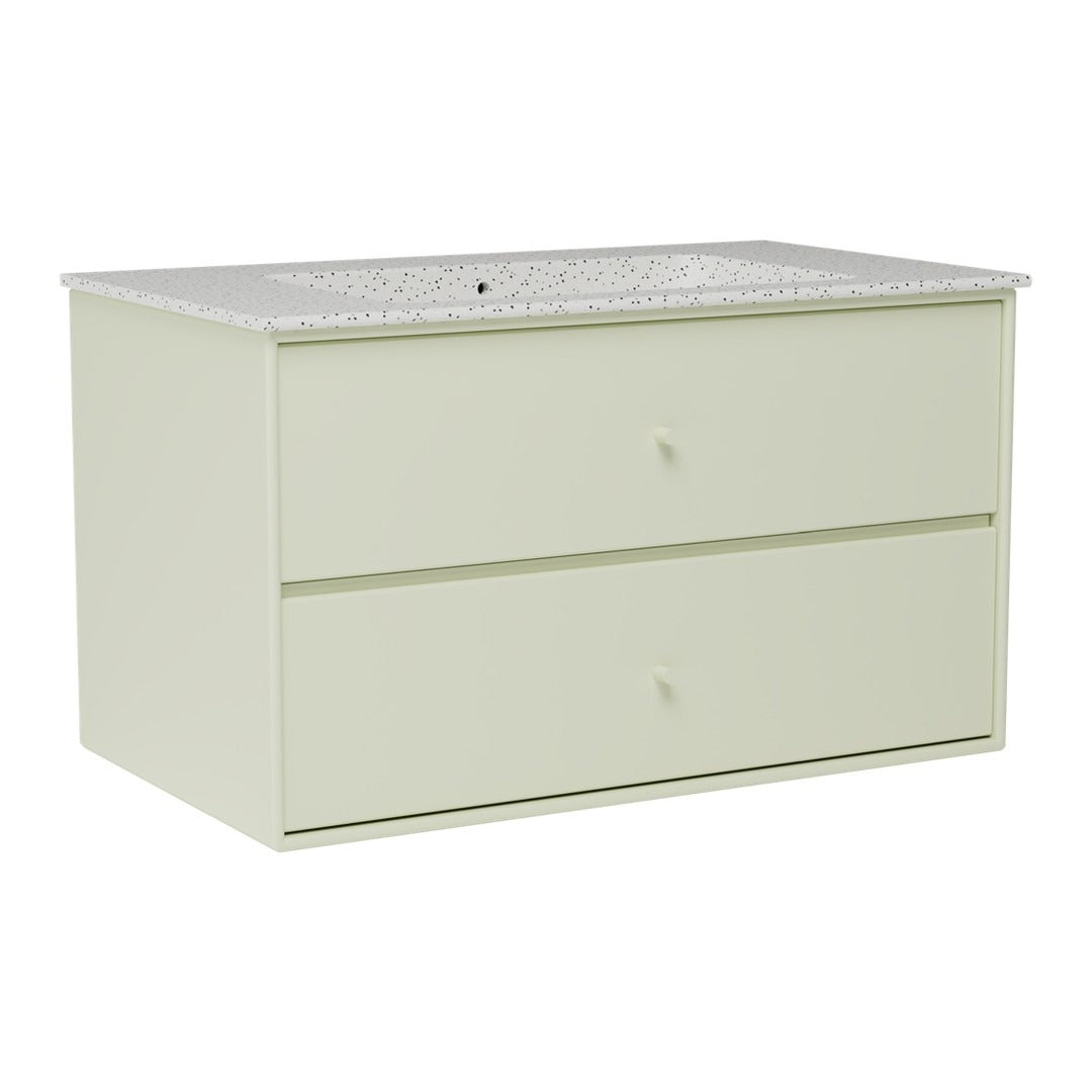 Light green dresser with a textured white speckled top and two smooth drawers, offering a modern aesthetic.