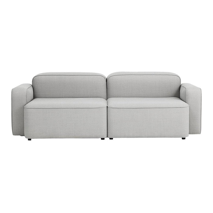 Light gray upholstered sofa with a sleek, modern design and subtle textured pattern. Perfect for contemporary interiors.