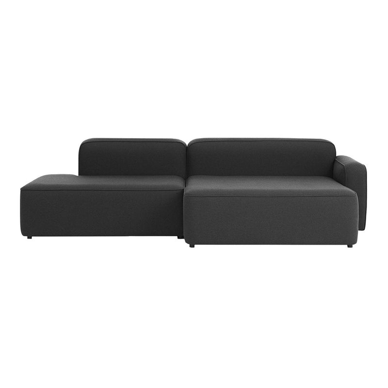 Modern black sectional sofa with a sleek, minimalistic design and straight lines for a contemporary look.