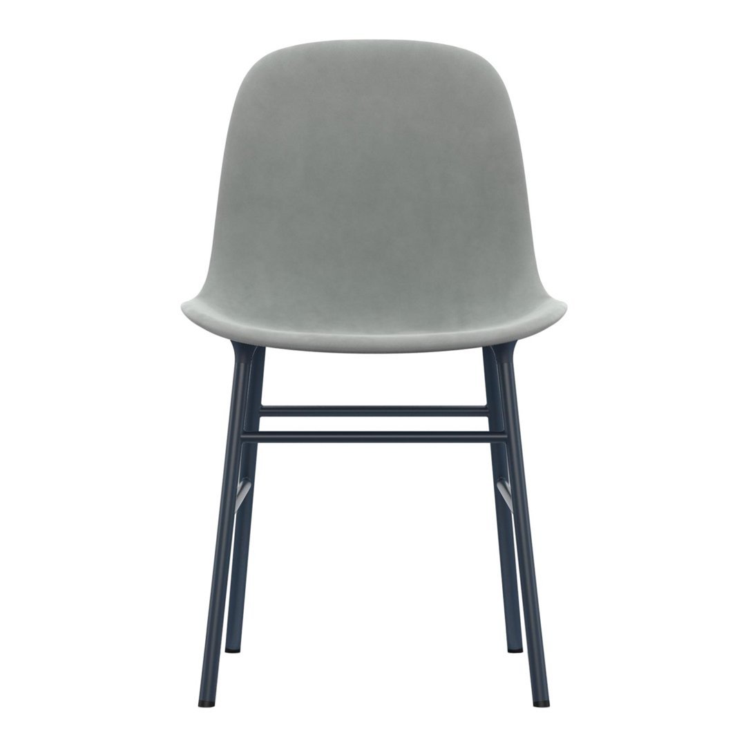 Gray velvet chair with a minimalist design and black metal legs, perfect for modern decor.