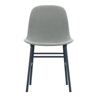 Gray velvet chair with a minimalist design and black metal legs, perfect for modern decor.