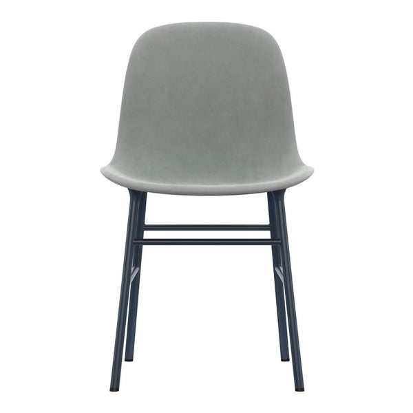 Gray velvet chair with a minimalist design and black metal legs, perfect for modern decor.