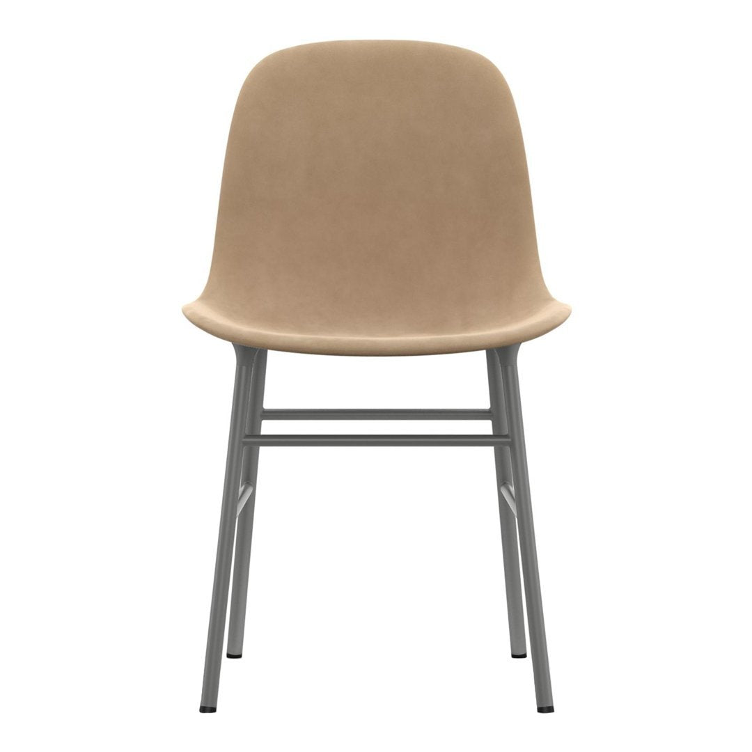 Beige upholstered chair with a smooth finish and sleek silver legs, ideal for modern interiors.