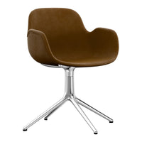 Brown velvet swivel chair with a sleek chrome base, featuring a modern, minimalistic design.