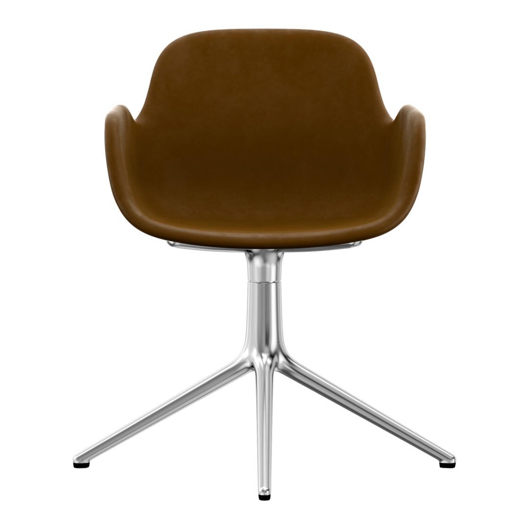 Brown velvet chair with a sleek chrome base, featuring a modern design and smooth curves.