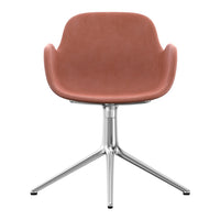 Rust-colored upholstered chair with a sleek silver metallic base, featuring a smooth, modern design.