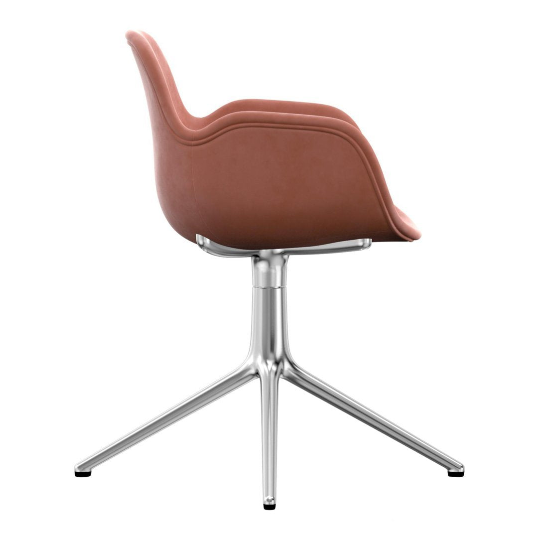 Brown upholstered chair with a smooth curve and sleek silver base, showcasing a modern design in neutral tones.