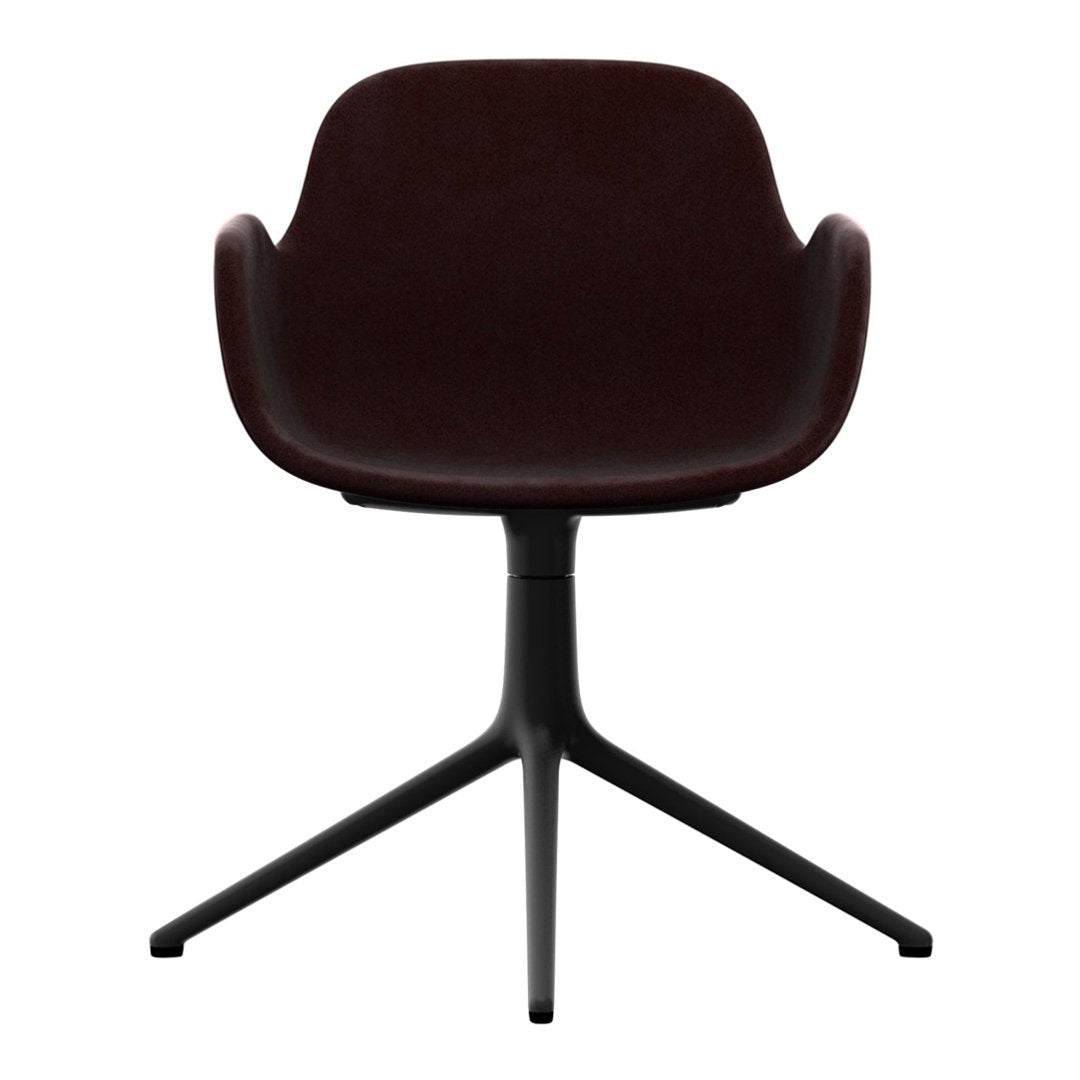 Dark burgundy upholstered chair with smooth contours and a sleek black three-legged base. Perfect for modern decor.