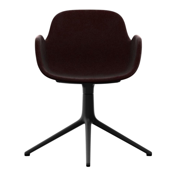 Dark burgundy upholstered chair with smooth contours and a sleek black three-legged base. Perfect for modern decor.