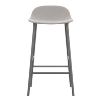 Modern grey bar stool with a smooth, minimalist design and contrasting silver legs. Ideal for contemporary spaces.