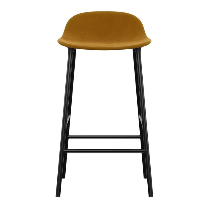 Mustard yellow upholstered bar stool with sleek black metal legs. Minimalist design and modern finish.