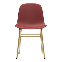 Red modern chair with a smooth, matte finish and gold metal legs, blending contemporary style and elegance.