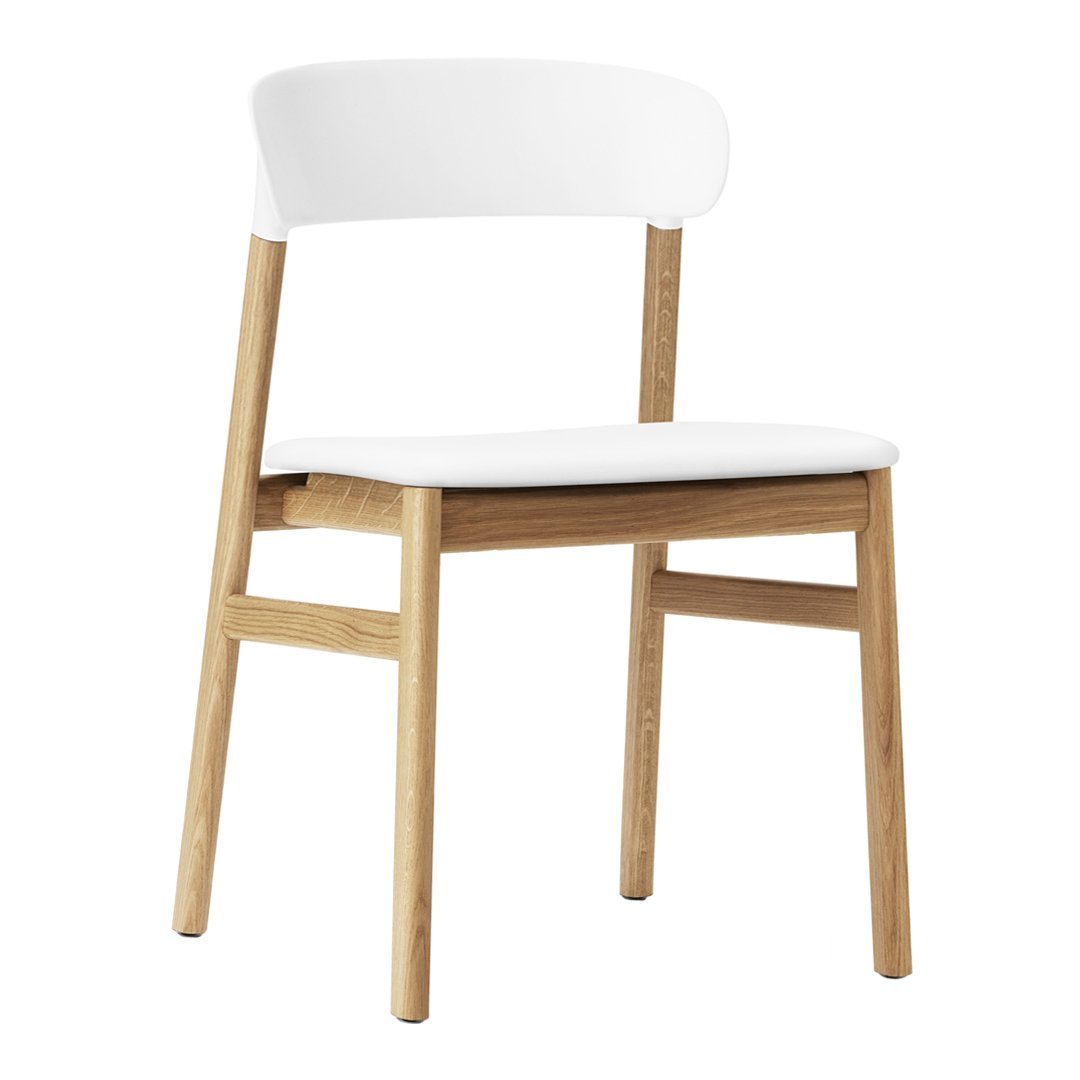 White and natural wood dining chair with a simple, sleek design and minimalistic aesthetic. Perfect for modern decor.