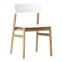 White and natural wood dining chair with a simple, sleek design and minimalistic aesthetic. Perfect for modern decor.