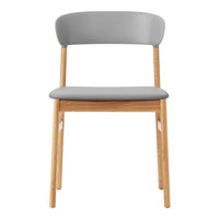 Gray upholstered chair with a smooth finish and natural wooden legs, featuring a minimalist design.