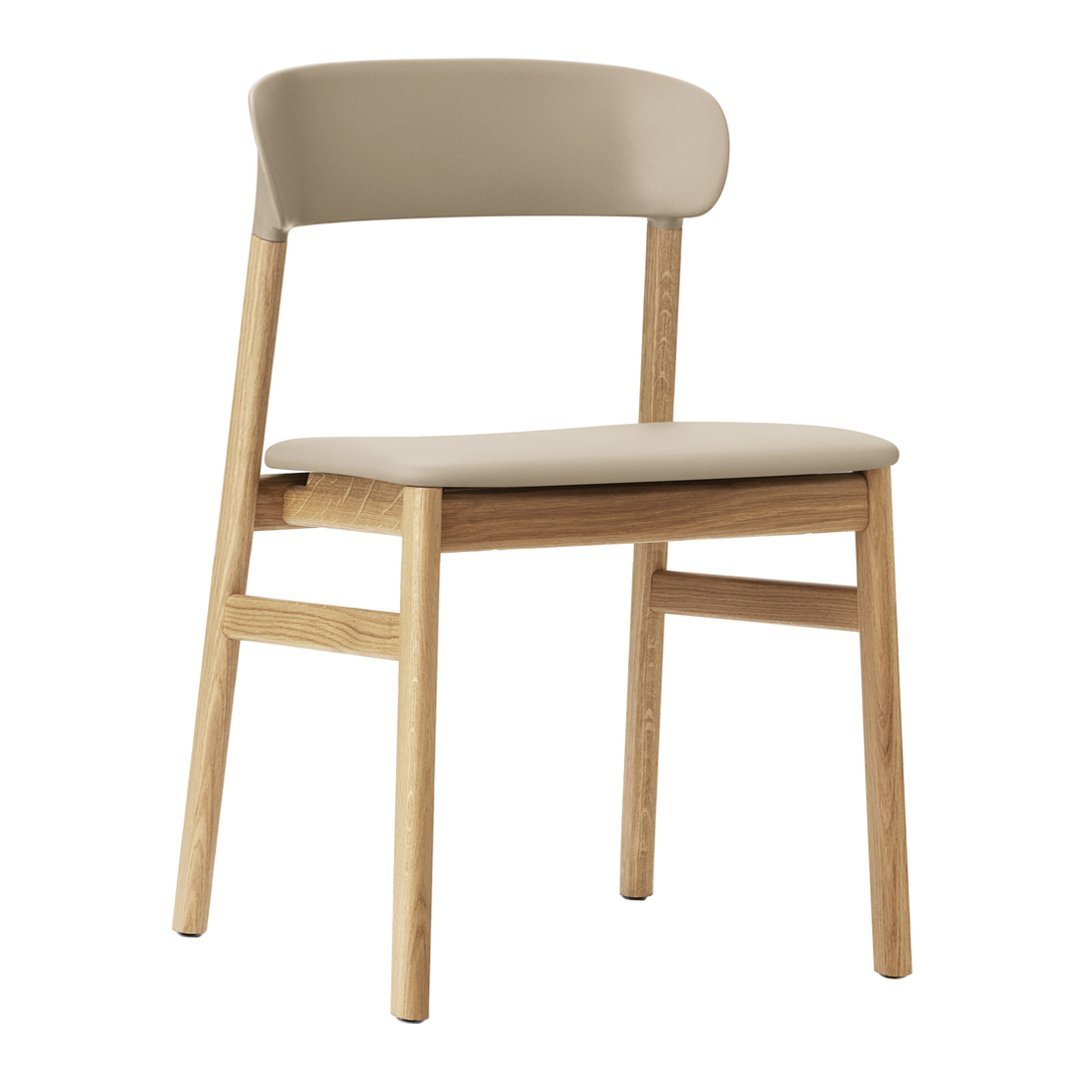 Beige upholstered chair with a natural bamboo wood frame, featuring a minimalist design and smooth color contrast.